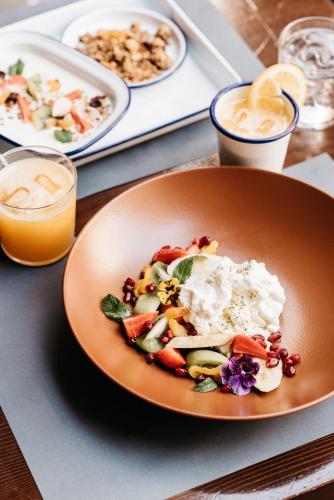 a plate of food on a table with plates of food at Five Elements Luxury Rooms in Split