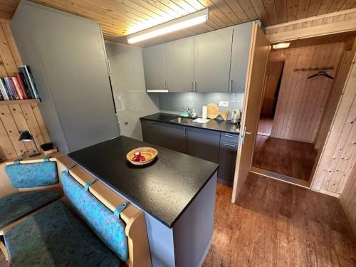a kitchen with a table and a couch in a room at Charming Apartment Only 150 Meters from the Ski Lift in Münster