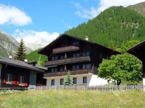 a large building in front of a mountain at Charming Apartment Only 150 Meters from the Ski Lift in Münster