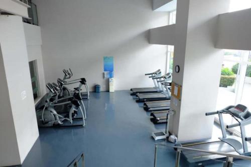 a gym with treadmills and elliptical machines at The Beacon Condo - Studio Tower 1 in Manila