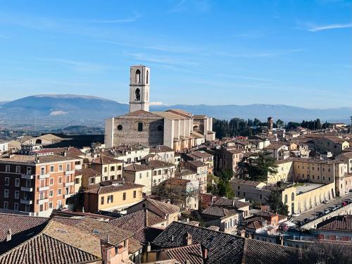 an aerial view of a city with a clock tower at ALLOGGIO TURISTICO IL TEMPIO in Perugia