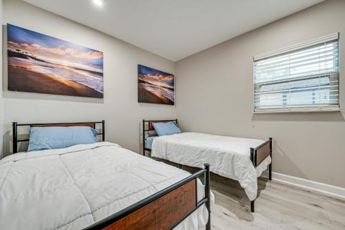 a bedroom with two beds and a window at Idyllic Oldsmar Vacation Rental 1 Mi to Beach! in Oldsmar