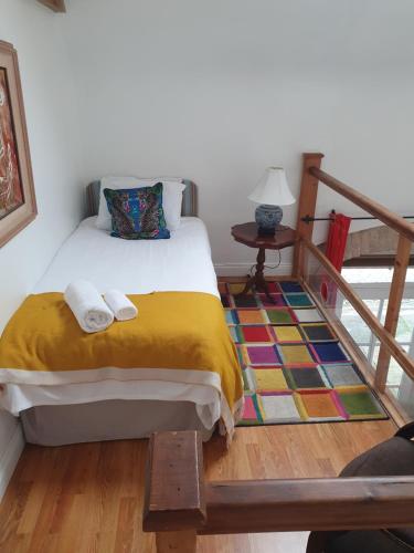 a bedroom with a bed and a rug at Loughcrew Courtyard House in Oldcastle