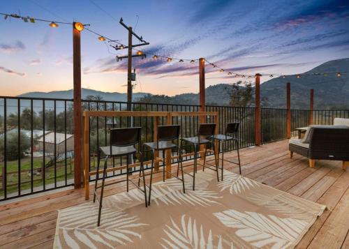 a deck with chairs and a table with a view at 4 Miles to Sequoia NTL Park in Three Rivers