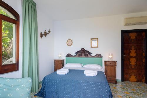 Ένα ή περισσότερα κρεβάτια σε δωμάτιο στο Villa Magnifico