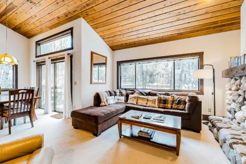 a living room with a couch and a table at Bridgepoint Condo on Trail Creek in Ketchum