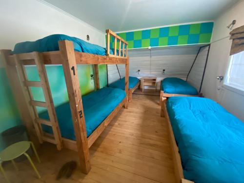 a bunk bed room with two bunk beds at La Guapa Hostel in Puerto Varas