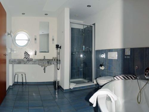 Ванна кімната в Hotel-Restaurant Thomsen