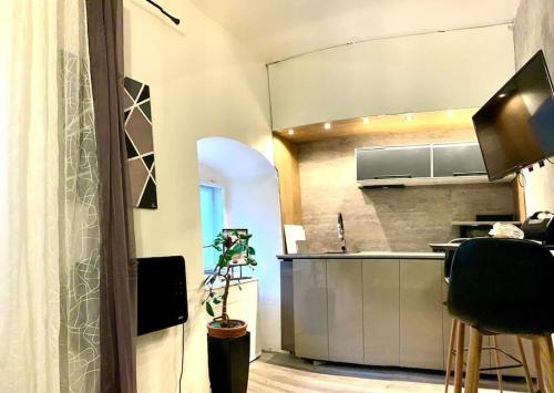 a kitchen with a sink and a counter top at K&H Apartman in Jihlava