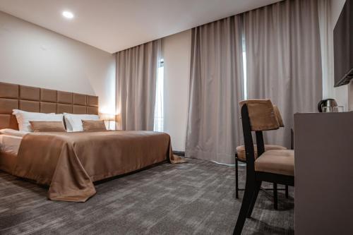 Postel nebo postele na pokoji v ubytování DARIC HOTELS