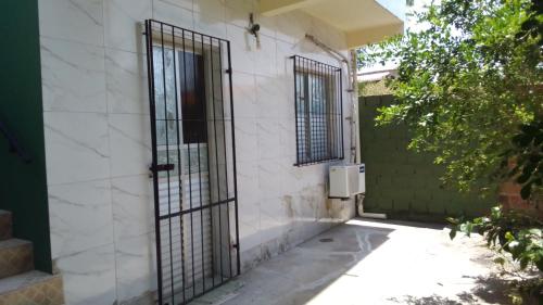 an entrance to a house with a gate at Beach House in Salinas da Margarida