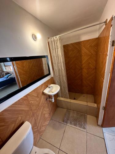 a bathroom with a shower and a sink at Capitan Brau's in Los Órganos