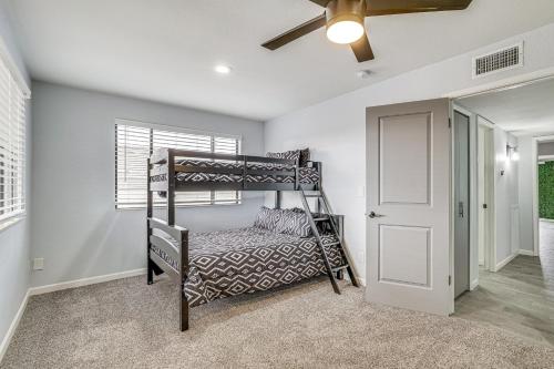 a bedroom with a bunk bed and a ceiling fan at Sunny Arizona Oasis with Views - 2 Mi to Lake Havasu in Lake Havasu City