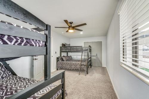 a bedroom with a bunk bed and a ceiling fan at Sunny Arizona Oasis with Views - 2 Mi to Lake Havasu in Lake Havasu City