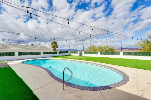a swimming pool in the middle of a yard at Sunny Arizona Oasis with Views - 2 Mi to Lake Havasu in Lake Havasu City