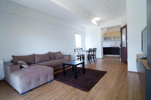 a living room with a couch and a table at Apido apartment in Kavadarci