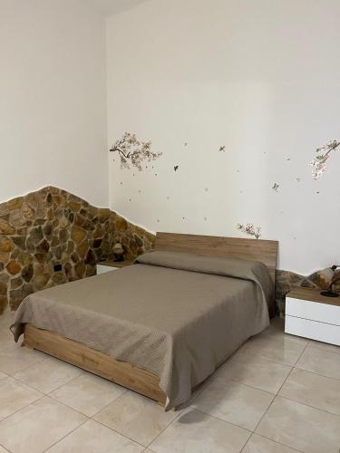 Ένα ή περισσότερα κρεβάτια σε δωμάτιο στο Dimora Cuoccio