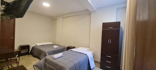 Voodi või voodid majutusasutuse Hospedaje Mónaco toas