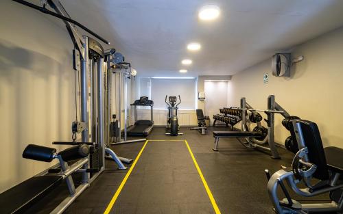 a gym with treadmills and machines in a room at Casa Andina Standard Trujillo Plaza in Trujillo