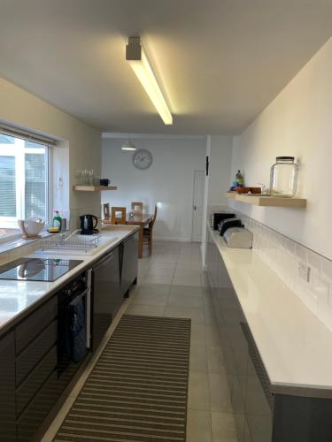 a kitchen with a sink and a counter top at Nunnery lane 3 bedroom house in York