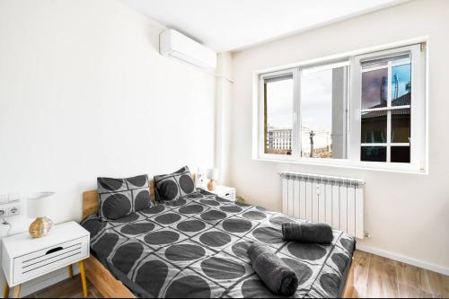a bedroom with a bed and a window at 1bdr Luxury Suit Prime Location Panorama Ac in Sofia