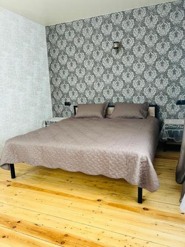 Postel nebo postele na pokoji v ubytování Kazbegi Palace