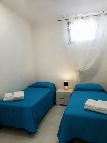 Ένα ή περισσότερα κρεβάτια σε δωμάτιο στο Casa Cinzia diamond 104