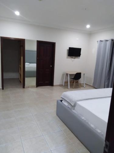 Ένα ή περισσότερα κρεβάτια σε δωμάτιο στο Micro Hotel Rio de Piedras