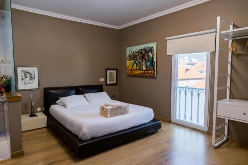 a bedroom with a bed with a box on it at Casa Vila Rosa in Peso da Régua