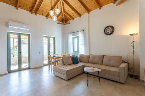 a living room with a couch and a table at Villa Daniela in Neokhórion