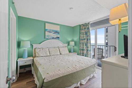 Ένα ή περισσότερα κρεβάτια σε δωμάτιο στο SeaWatch South 1002 Oceanview-Shore Drive Section