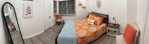 a bedroom with a bed with a cat laying on it at 2BR Gem: Modern Comfort & Style in Cheyenne