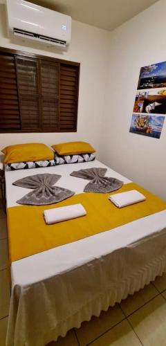 Posteľ alebo postele v izbe v ubytovaní Casa privativa próximo ao centro e aeroporto.