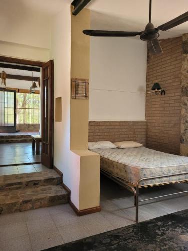 a bedroom with a bed in a room at Casona y Casa de Campo in Santa María