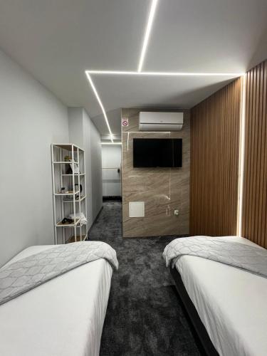 Katil atau katil-katil dalam bilik di Luxury Room 's