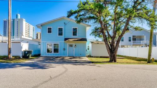 a blue house with a tree in the street at High Tide - 3rd Row - Crescent Beach Section in Myrtle Beach