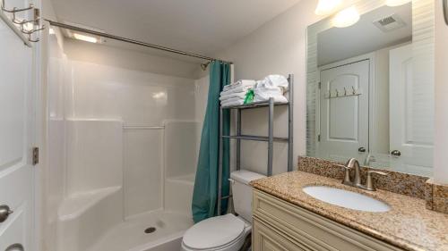 a bathroom with a sink and a shower and a toilet at High Tide - 3rd Row - Crescent Beach Section in Myrtle Beach