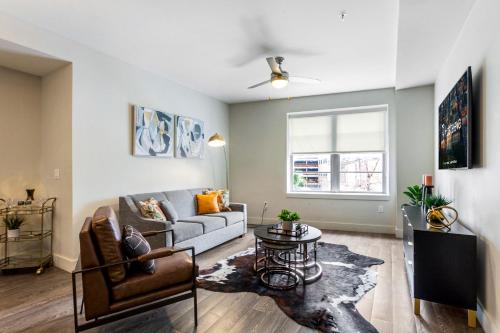 a living room with a couch and a table at Peaceful Condo Walking Distance to Bourbon Street in New Orleans