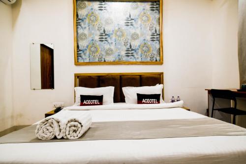 Postel nebo postele na pokoji v ubytování Aceotel Inn Flamingo