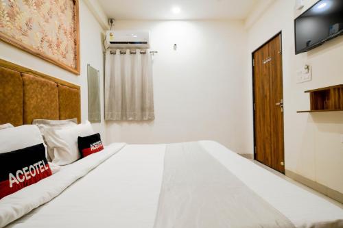 Postel nebo postele na pokoji v ubytování Aceotel Inn Flamingo