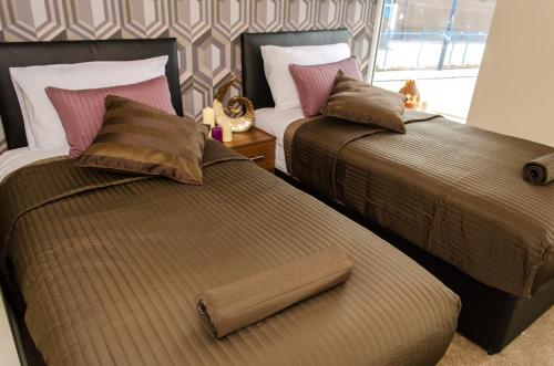 Ένα ή περισσότερα κρεβάτια σε δωμάτιο στο Trivelles Eccles