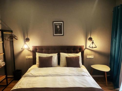 Una cama o camas en una habitación de Hotel Classic Corner