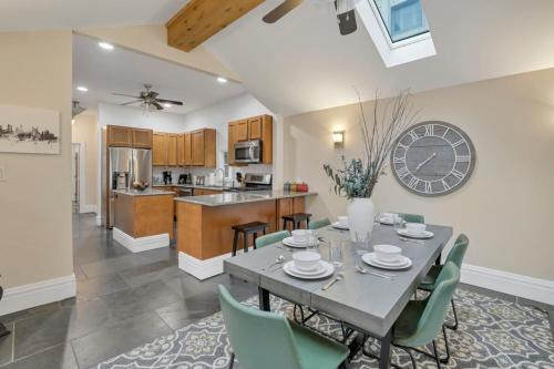 a dining room and kitchen with a table and chairs at OSU and Short North 4 Bedroom Patio and Garage with EV in Columbus