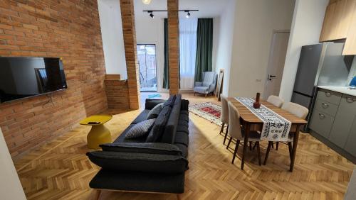 a living room with a couch and a table at Apartment 1905 in Tbilisi, Avlabari in Tbilisi City