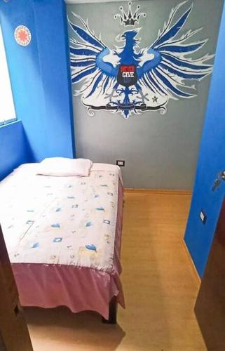 A bed or beds in a room at Departamento en Cusco