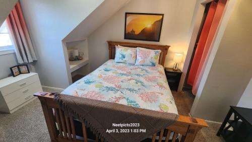a small bedroom with a bed in the attic at Inn at Arch Rock in Depoe Bay
