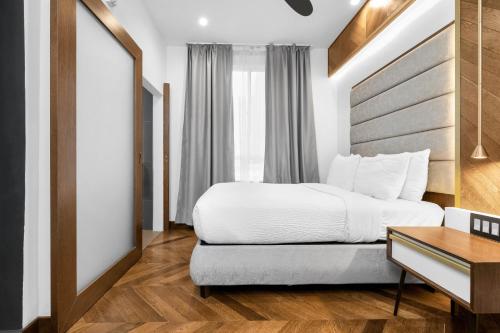 a hotel room with a bed and a desk at Hotel 32One in San Francisco