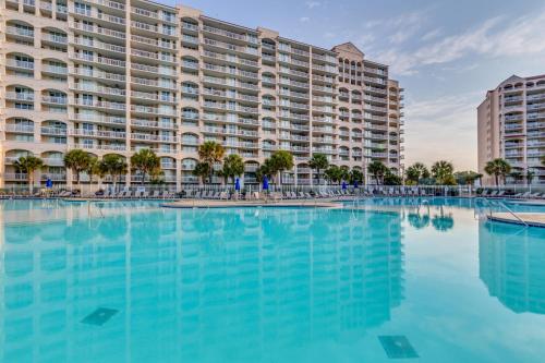 a large swimming pool in front of a large building at Barefoot Resort - North Tower 905 - Windy Hill in Myrtle Beach