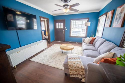 a living room with blue walls and a couch at Sunny Retreat near San Diego Zoo, Beach & Downtown in San Diego