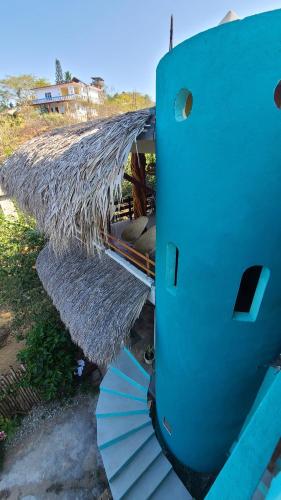 a close up of the back end of a blue boat at Mar de Fondo in Puerto Escondido
